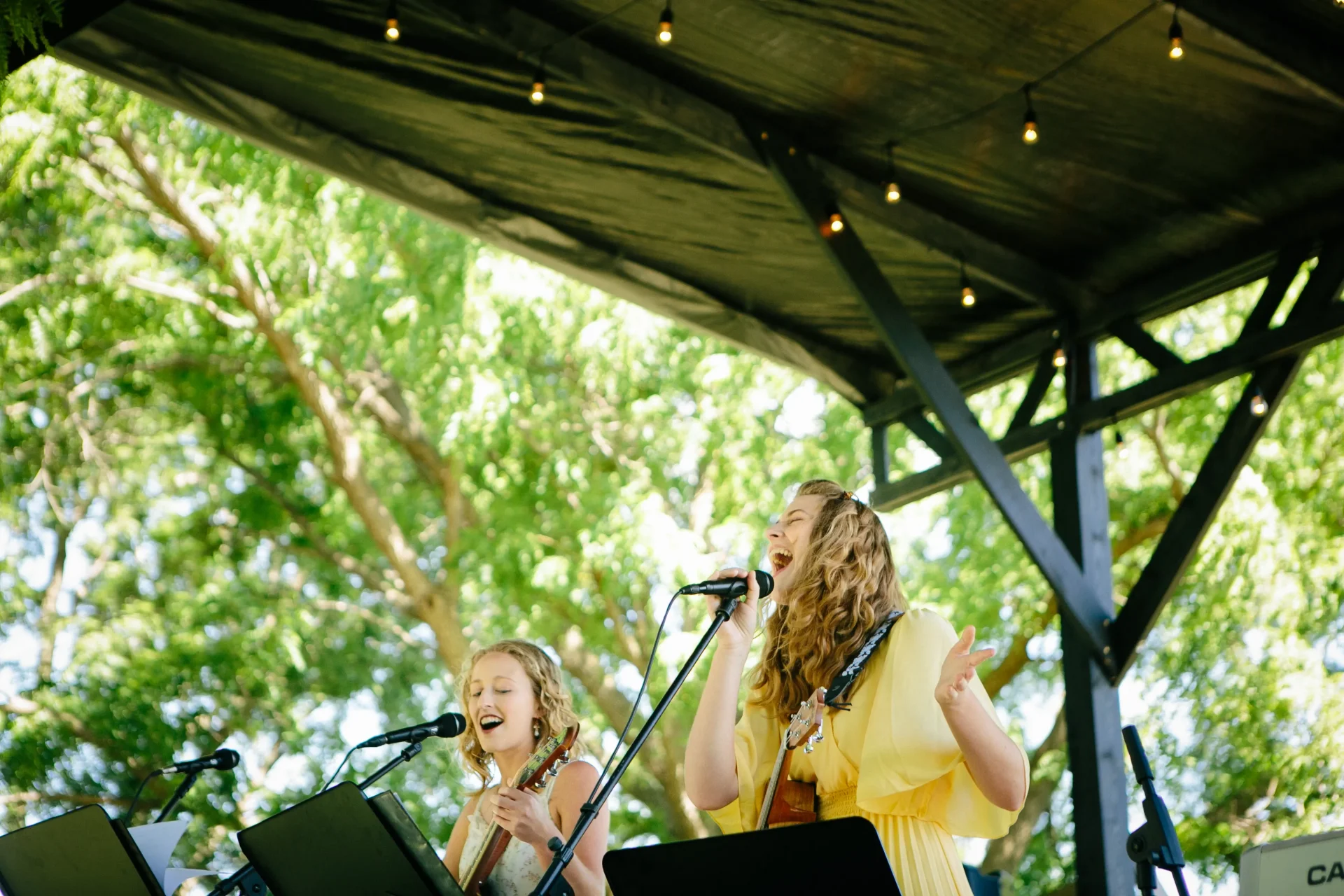 Two independent artists singing on stage at Proclaim