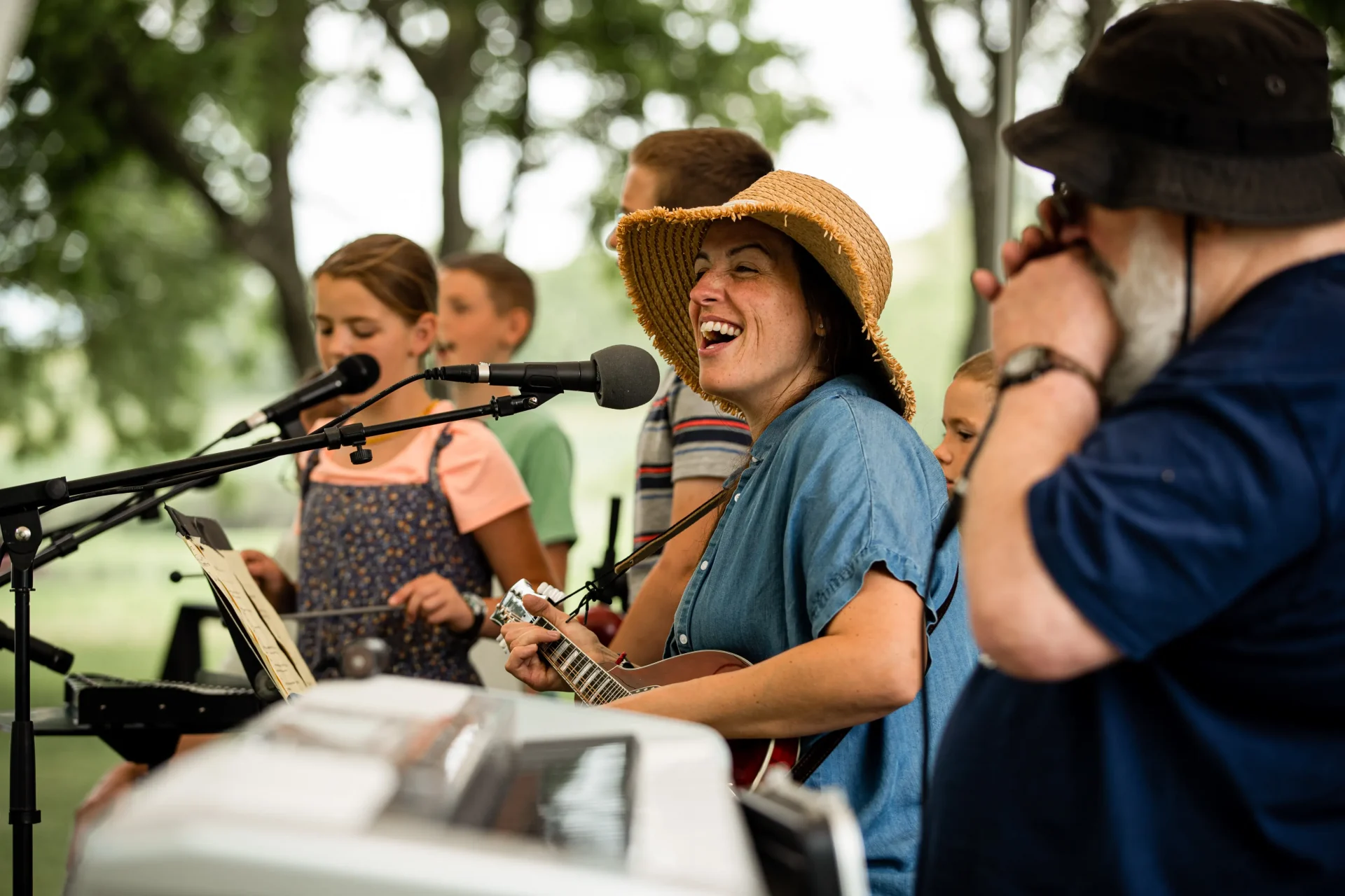 Sady DeLapp playing guitar and singing at Proclaim